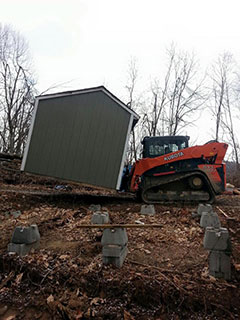 Hauling and relocating out buildings and sheds.