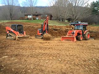 Backhoe, front loader, bulldozer, tractor for excavating and plowing.